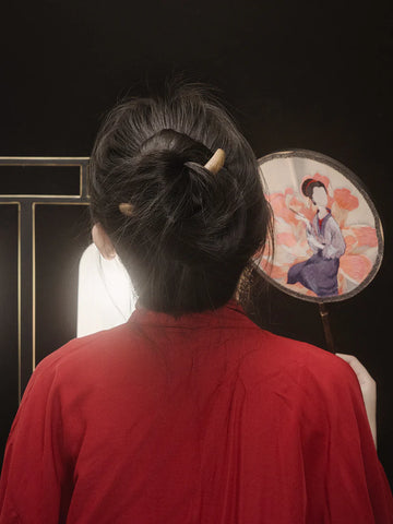 Half-moon-hair-sticks-messy-bun